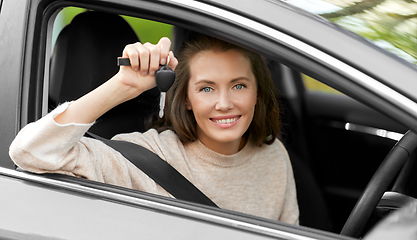 Image showing woman or female driver with car key in city