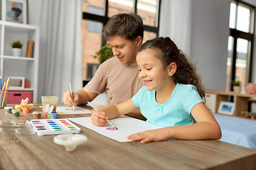 Image showing happy father with little daughter drawing at home