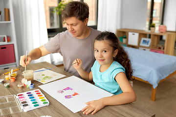 Image showing happy father with little daughter drawing at home