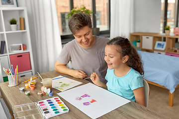 Image showing happy father with little daughter drawing at home