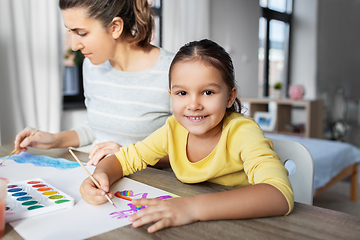 Image showing mother with little daughter drawing at home