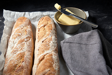 Image showing close up of bread, butter and knife on towel