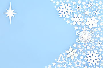 Image showing Christmas Star of Bethlehem and Snowflake Blue Background 