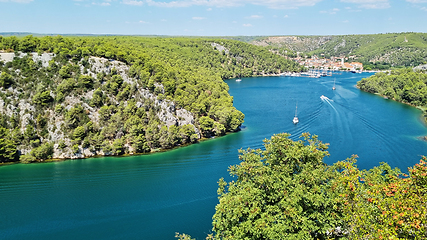 Image showing Aerial view of Skradin town on the Krka River in Croatia. View of boats on Krka river, Croatia. Summer day