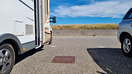 Image showing Caravan car vacation. Family vacation travel RV. Holiday trip in motorhome. Zandvoort sand dunes, Netherlands