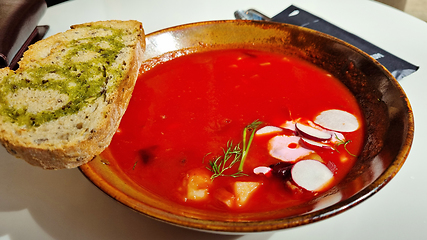 Image showing Hot rich fresh borscht, beet soup with vegetables on a plate