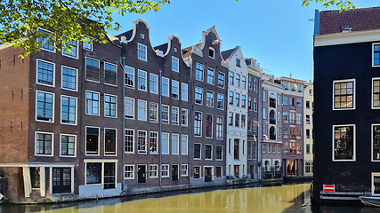 Image showing Channel in Amsterdam Netherlands. Houses river Amstel landmark. Old European city summer landscape