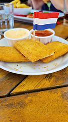 Image showing Roasted cheese sticks on a plate with Netherlands flag