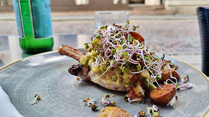 Image showing Grilled beef steaks and germinated sprouts on a plate