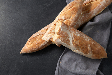 Image showing close up of baguette bread on kitchen towel