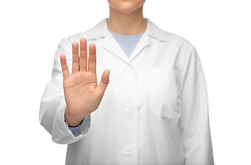 Image showing female doctor in white coat showing stop gesture