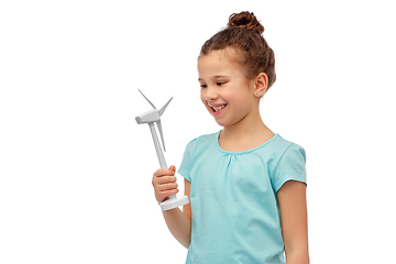 Image showing smiling girl with toy wind turbine