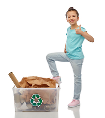 Image showing girl sorting paper waste and showing thumbs up