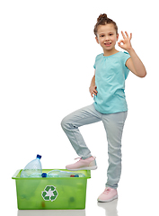 Image showing smiling girl sorting plastic waste showing ok sign