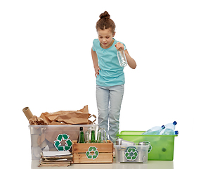 Image showing happy girl sorting paper, metal and plastic waste