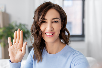 Image showing happy woman taking selfie at home