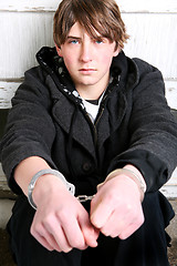 Image showing teenager in handcuffs