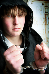 Image showing teenager in handcuffs