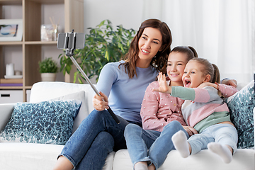 Image showing happy family taking selfie by smartphone at home