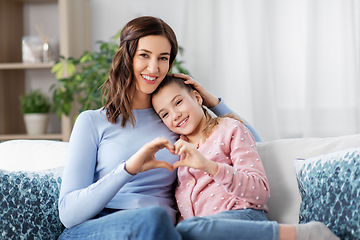 Image showing happy smiling mother with daughter at home