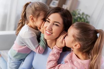 Image showing happy mother and daughters gossiping at home