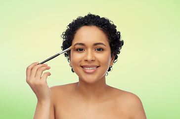 Image showing african american woman with make up brush