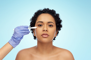 Image showing african american woman and hand with scalpel knife