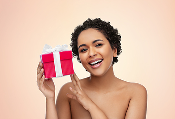 Image showing portrait of young african american woman with gift