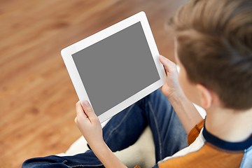 Image showing close up of boy with tablet pc computer at home