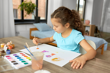 Image showing little girl with colors drawing picture at home