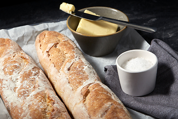 Image showing close up of bread, butter and knife on towel