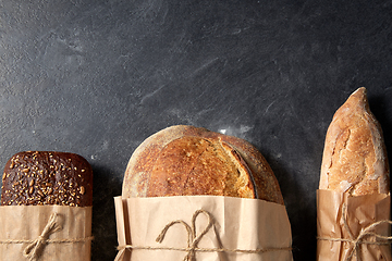 Image showing close up of bread in paper bags on table