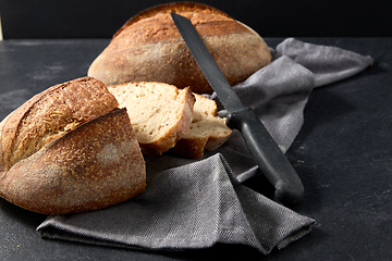 Image showing homemade craft bread with kitchen knife