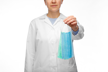 Image showing female doctor showing two medical masks