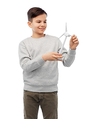 Image showing smiling boy with toy wind turbine