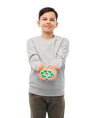 Image showing smiling boy holding green recycling sign