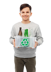 Image showing smiling boy sorting glass waste