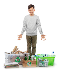 Image showing smiling boy sorting paper, metal and plastic waste