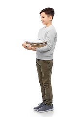 Image showing smiling boy with magazines sorting paper waste