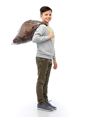 Image showing smiling boy with paper garbage in plastic bag