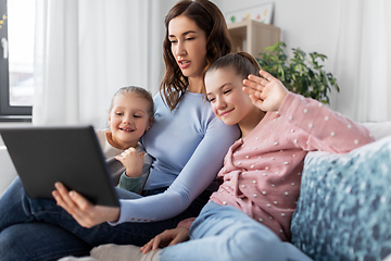 Image showing mother and children having video call on tablet pc