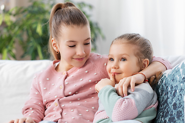 Image showing two happy smiling little girls or sisters at home