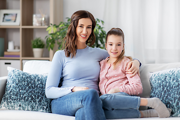 Image showing happy smiling mother with daughter at home