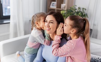 Image showing happy mother and daughters gossiping at home