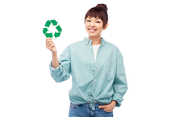 Image showing smiling asian woman holding green recycling sign