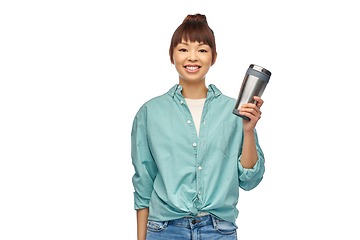 Image showing woman with thermo cup or tumbler for hot drinks