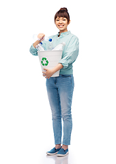 Image showing smiling young woman sorting plastic waste