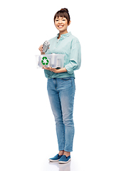 Image showing smiling young asian woman sorting metallic waste