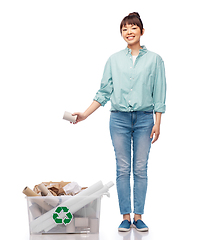 Image showing happy smiling asian woman sorting paper waste