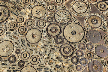 Image showing Floor with pattern from pebbles and rusty metal details